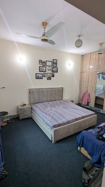 King sized bed with side tables and storage