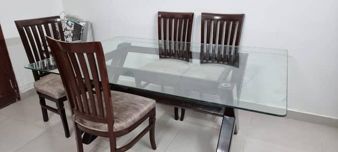 Dinning table with 6 chairs and glass top