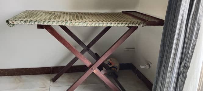 Foldable wooden ironing table with iron compartment