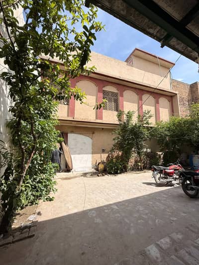 10 Marla House with 3 Shops - Dalazak Road Peshawar