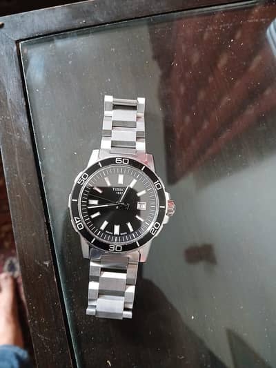 Tissot Supersport Gent with a black dial.