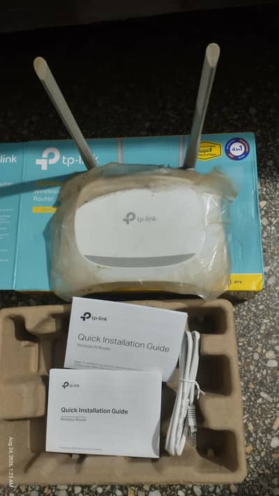 TP-Link router with box end PTCL router with charger
