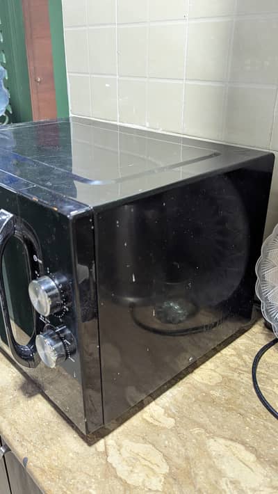 Haier Solo Microwave Oven – Stylish & Efficient Kitchen Appliance