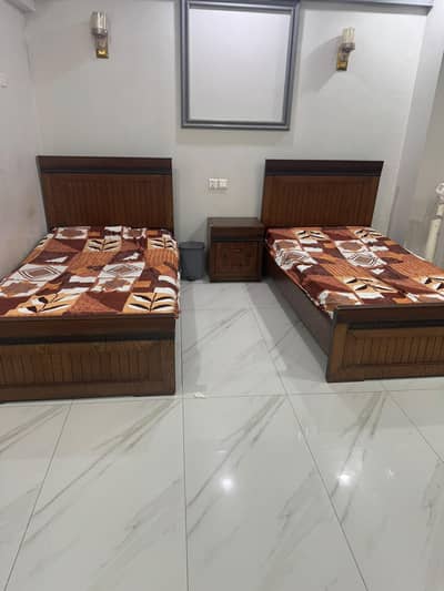 Two single size bed with diamond medicare mattress and side table
