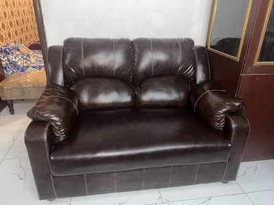 4 month used 10/10 condition brown leather 5 seater sofa with table