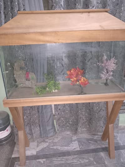 fish aquarium with wooden stand