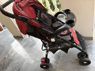 Baby stroller in red
