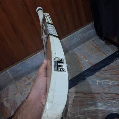 Tape ball cricket bat .