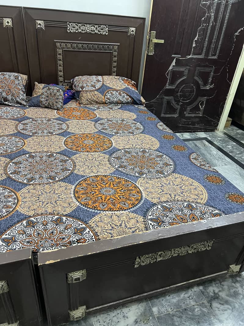 2 single bed and 1 table 1