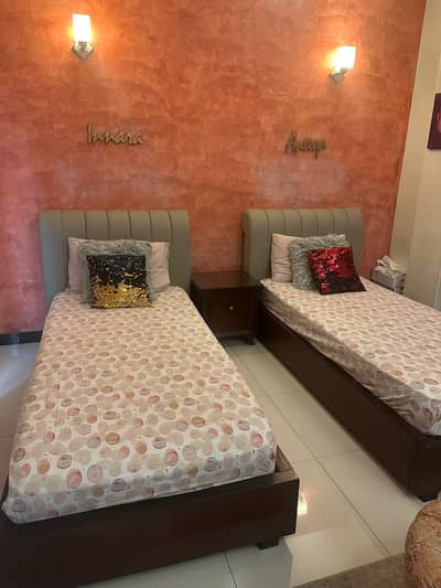2 single beds, 1 centre table, dressing table and ottoman