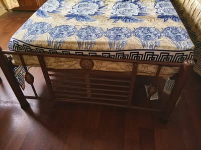two single iron beds
