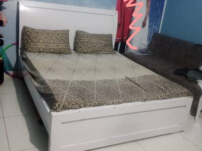 Queen size bed with mattress. . .