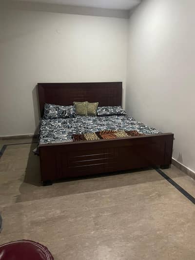 Wooden double bed for sale