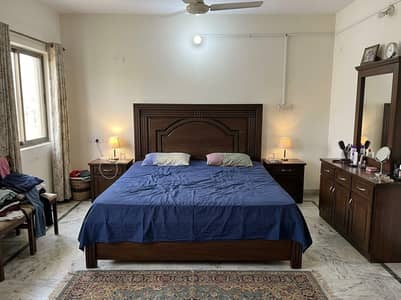 bed with sidetables and dressing