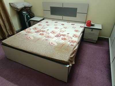 Queen Size Bed with 2 side table and a wardrobe/almari