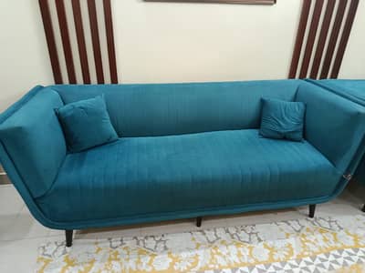 7 seater sofa set with 7 pillows/cushions, center table and 2 curtains
