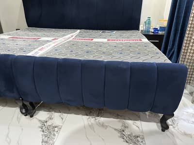 2 single wooden bed converted to modern style with mattresses.
