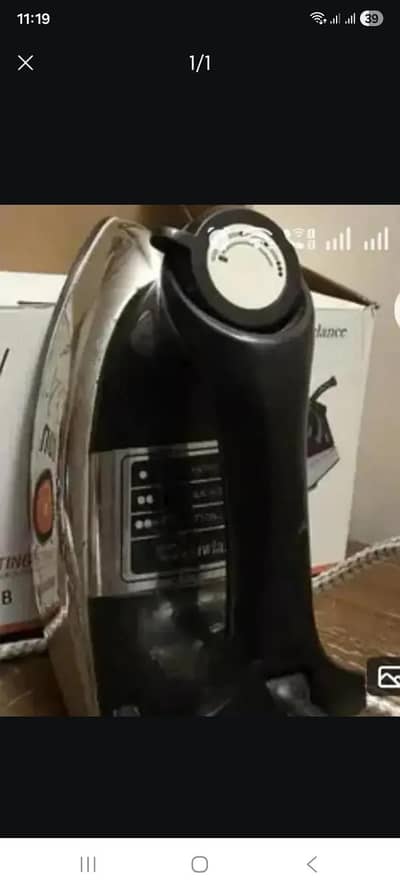 Great condition.  Black and silver coloured iron with box sale
