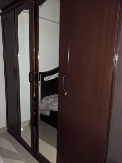 4 Door wardrobe Wooden  used brown in color