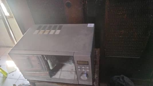 Haier solo microwave oven 20L silver color and good condition