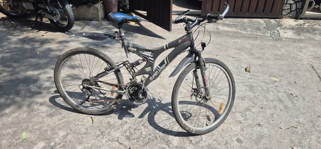 18" Good Condition bicycle with shock absorbers for sale