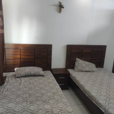 2 single beds with mattress and Centre table