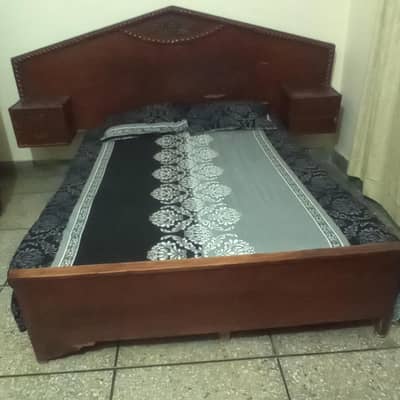 bed with mattress and dressing