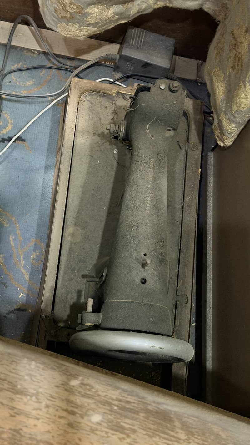Two Singer machine 3