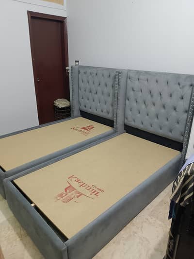 02 wooden beds with metres and 01 side table