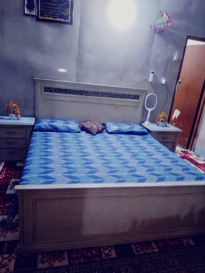 Double Bdouble beds with side table dressing and chairs