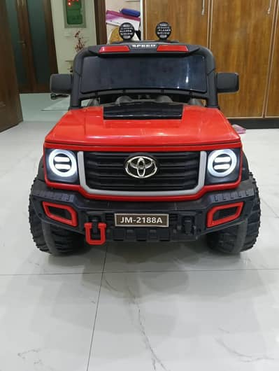 Red kids Jeep with extended battery