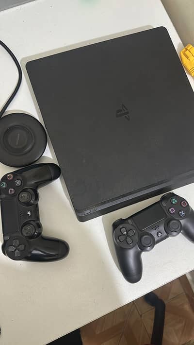 PS4 Slim 1tb with 2 wireless controllers + Uncharted 4 Game disc