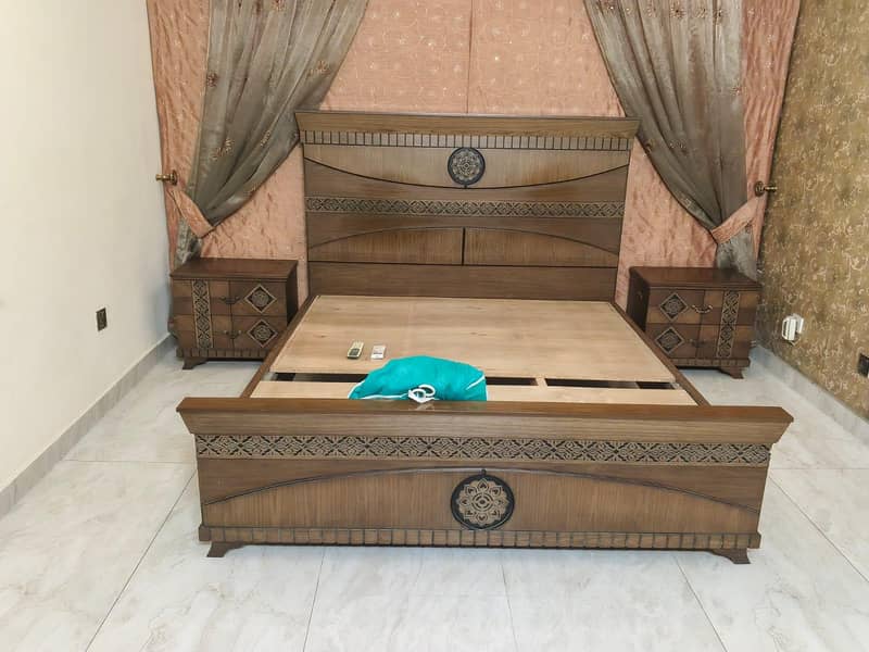king size bed  sides table . mirror 0