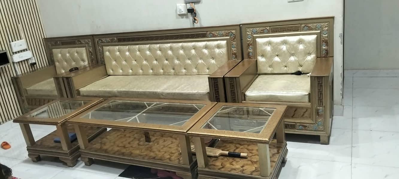 Six setter sofa set with 2 small tables and one large table. 2