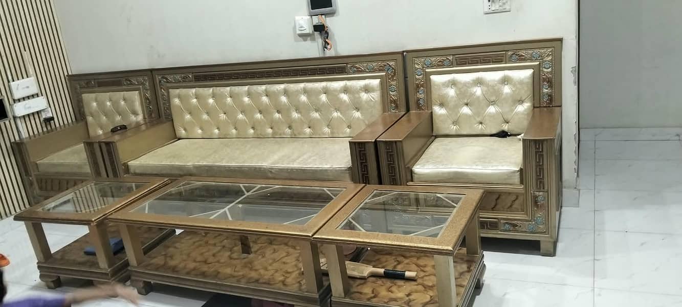 Six setter sofa set with 2 small tables and one large table. 3