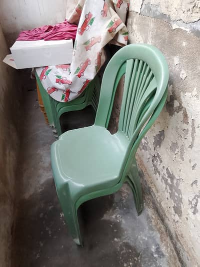 Plastic chairs and plastic table. . .