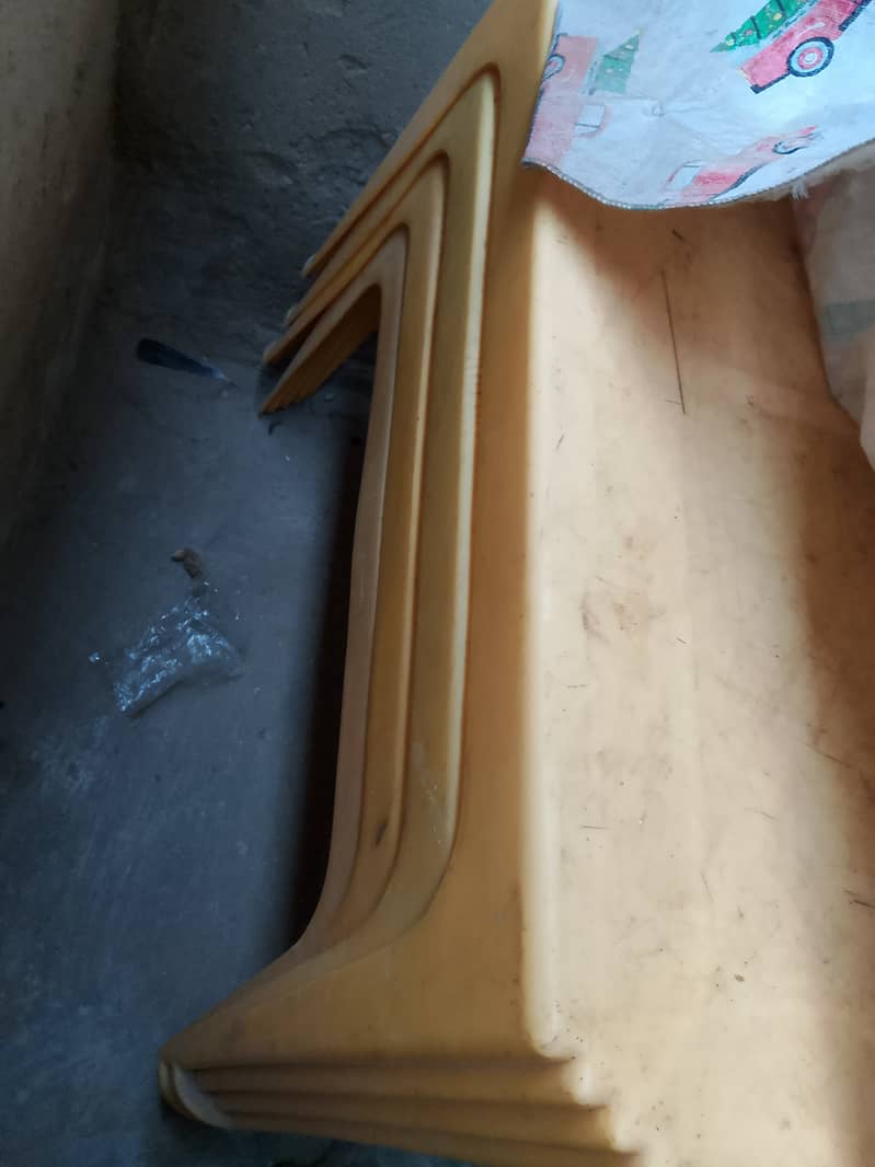 Plastic chairs and plastic table. . . 2