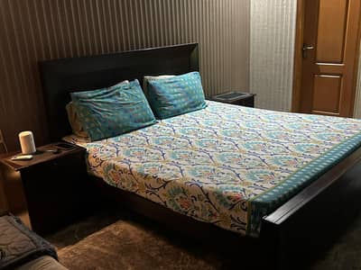 wooden bed without mattress