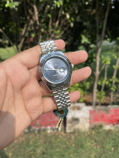 Rollexx Watch for Men in blue dial.
