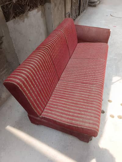 one sofa combed and one single seater wooden solid sofa pice