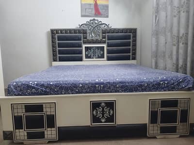 King size bed with two side table and one wardrobe