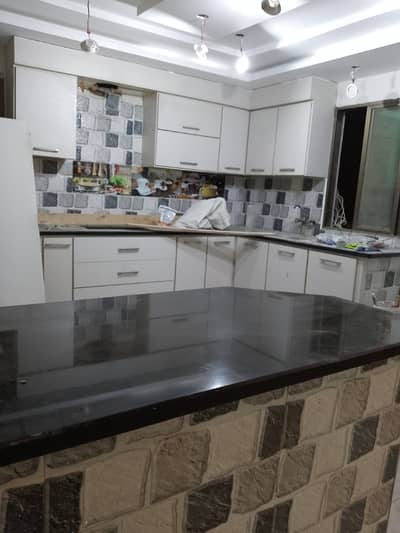 Brand New 2 bed drawing lounge 2 ND floor portion for rent tiled flooring America kitchen tiled washrooms 24 hours water and electricity separate gate and meters