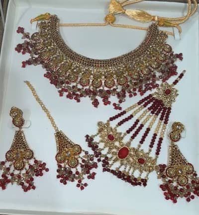 Bridal kundan jewellery with red beads-necklace,Earrings,tika & jhomer