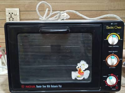 nova baking and roaster oven with rotisserie pick