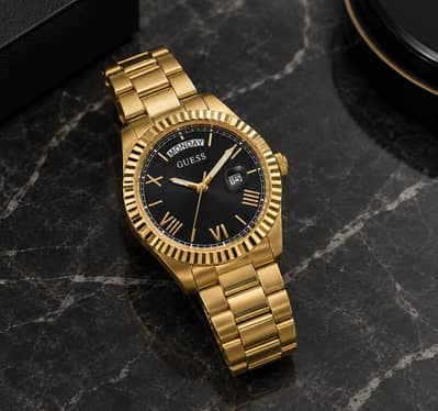 GUESS gold-tone stainless steel black dial roman numerals day and date