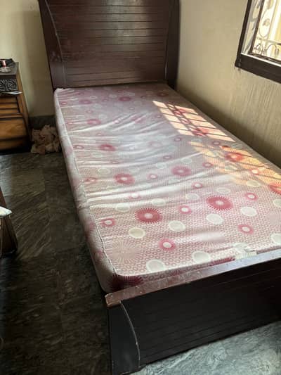 Single wooden bed with metres