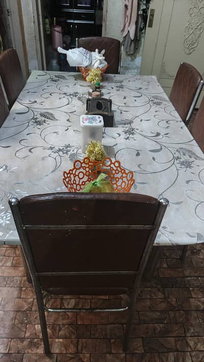 dinning table with 6 chairs glass top urgent sell