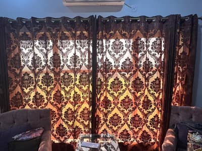 Brown palichi curtains for 2 windows