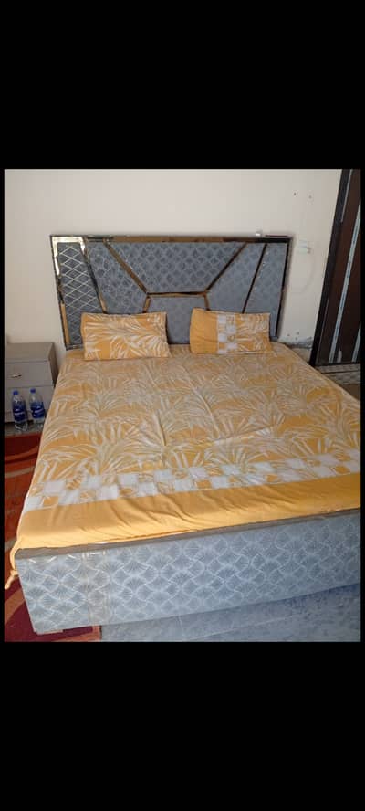 Bed with metres and 2 side tables