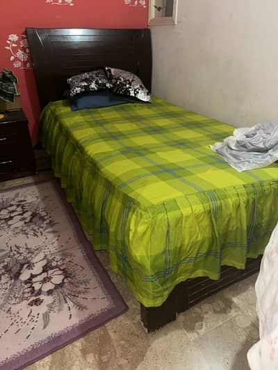 2 single beds with 1 side table and 1 double bed just